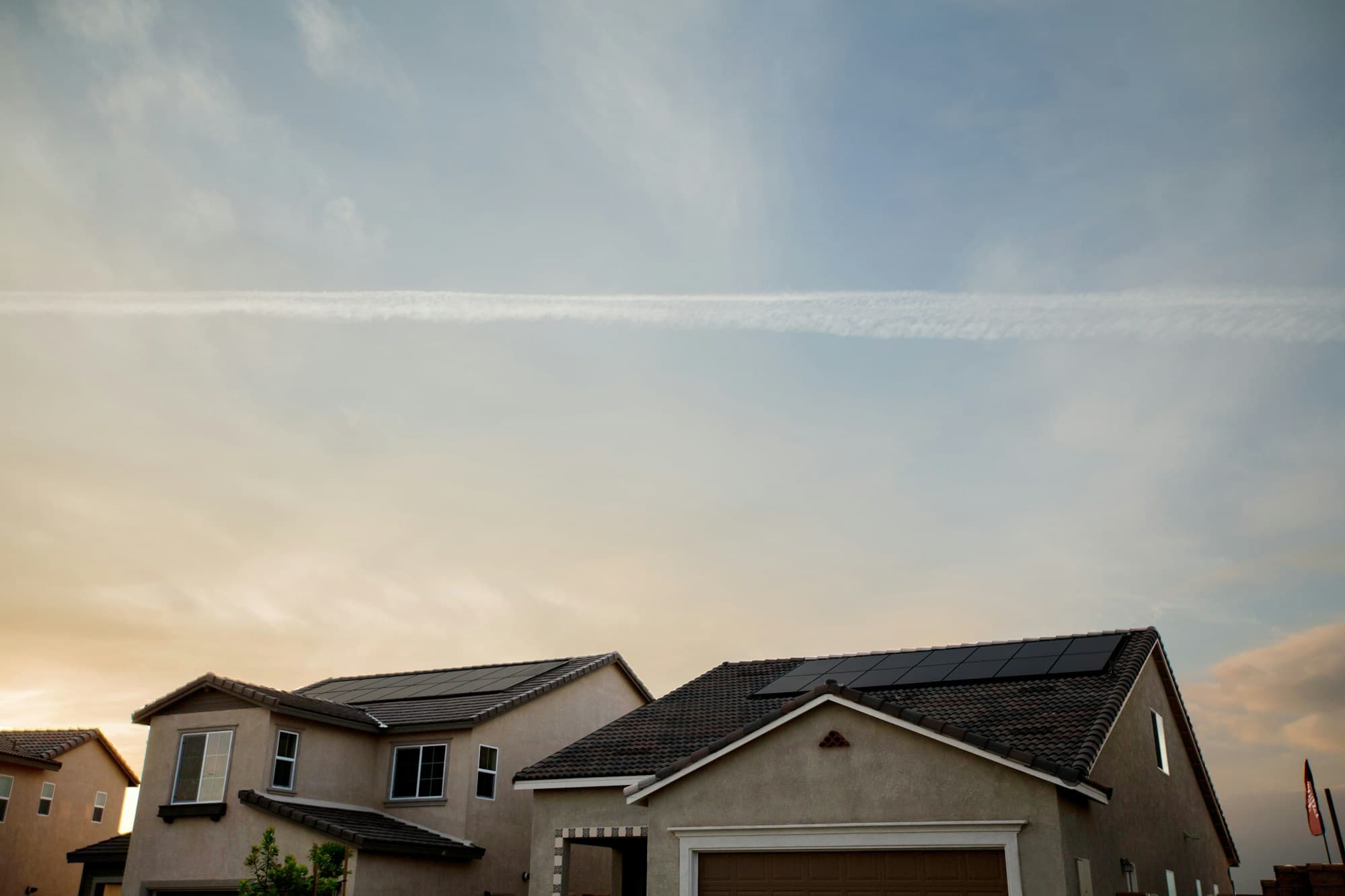 Homes with rooftop solar in the evening light